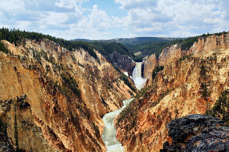 Yellowstone National Park with a waterfall and stream